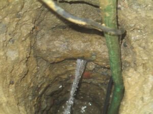 Broken water line below ground