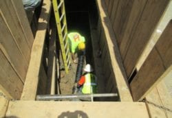 Installing pipe under sidewalk