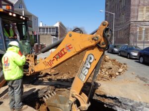 Excavating with backhoe