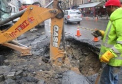 Removing debris in preparation for new pipe
