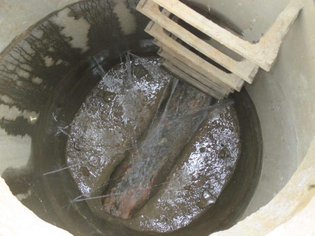 Water main leaks into city manhole