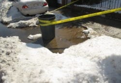 Example of water main leak in roadway