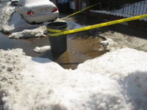 Example of water main leak in roadway