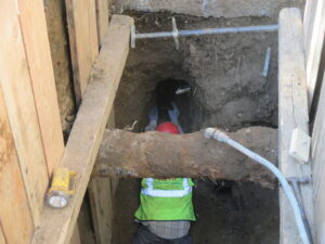 Installing pipe through tunnel