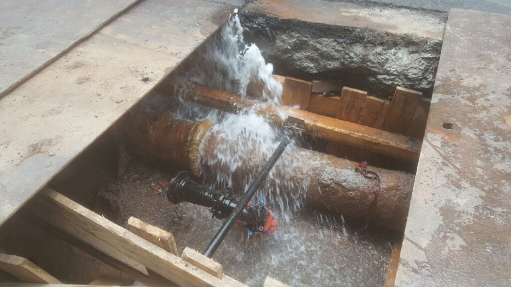 water main flooding street