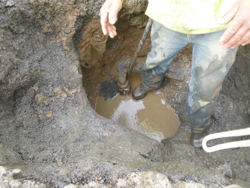 Leaking water main tap connection