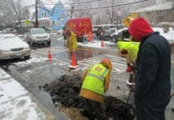 Digging to repair broken water main from cold weather