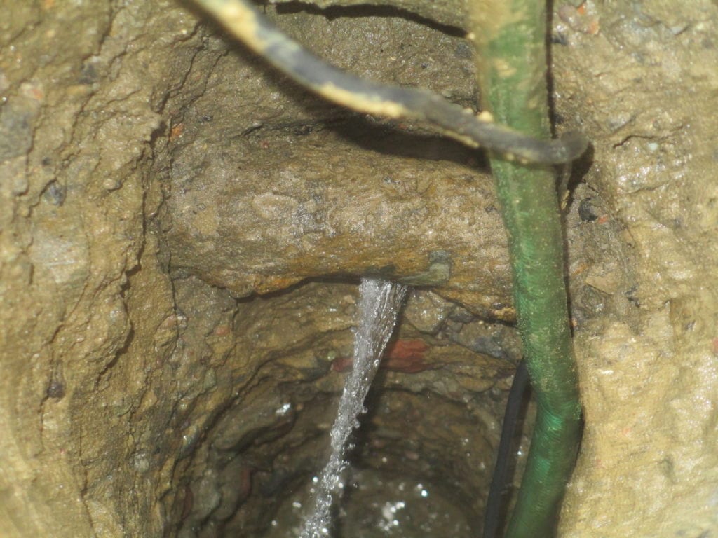 Water main leak below ground