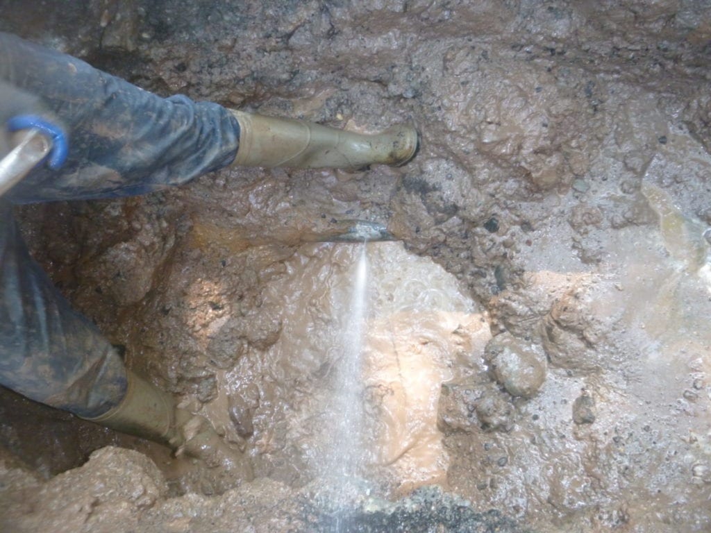 Old water main leaking below street