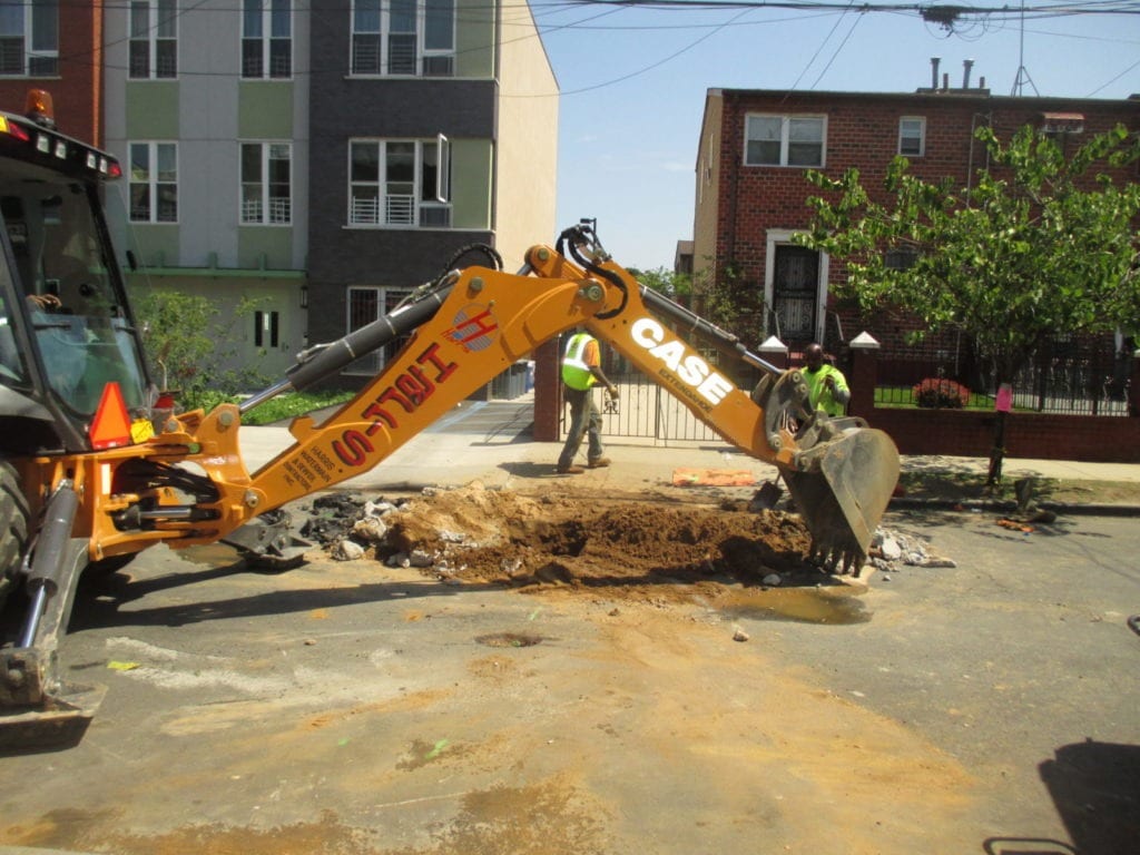 Excavating over city main