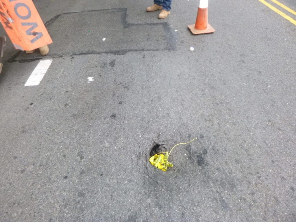 broken sewer causes Roadway sinkhole NYC
