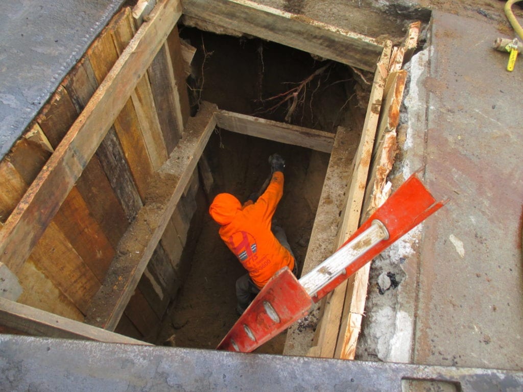 Removing soil for 6" cast iron pipe