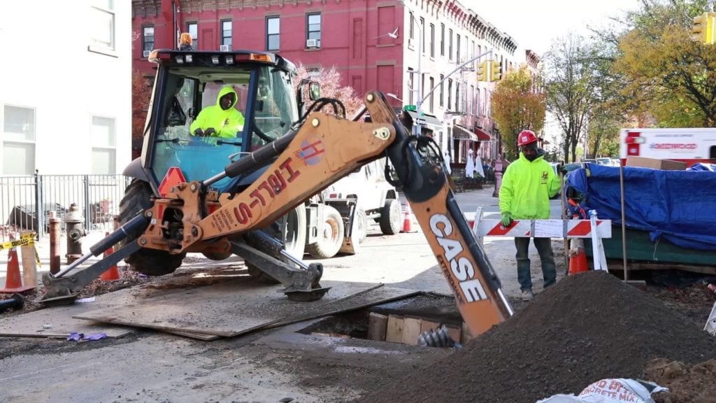 Sewer repair excavation with backhoe