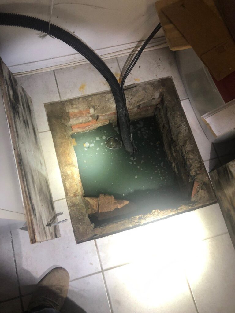 Main sewer back up in trap area