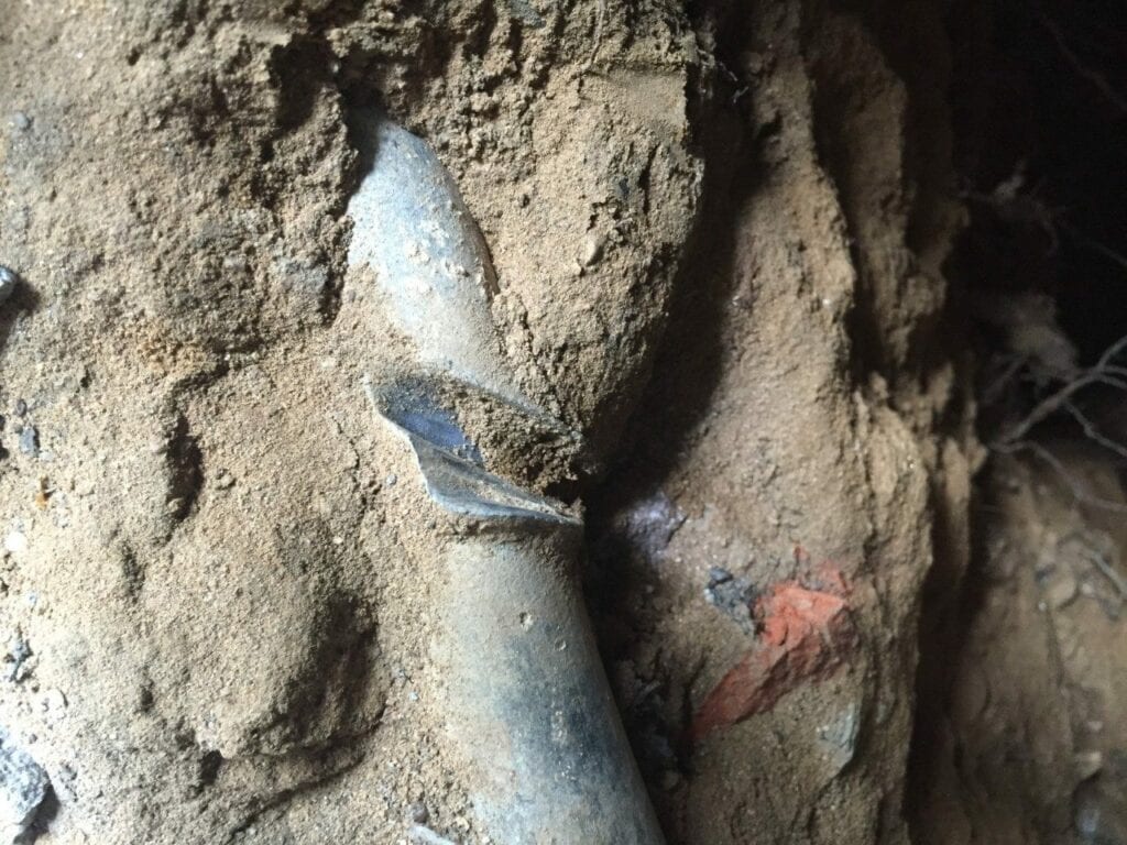 Lead water main with indent