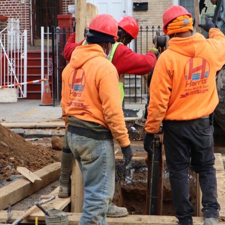 “Technician performing water main repair in Brooklyn”