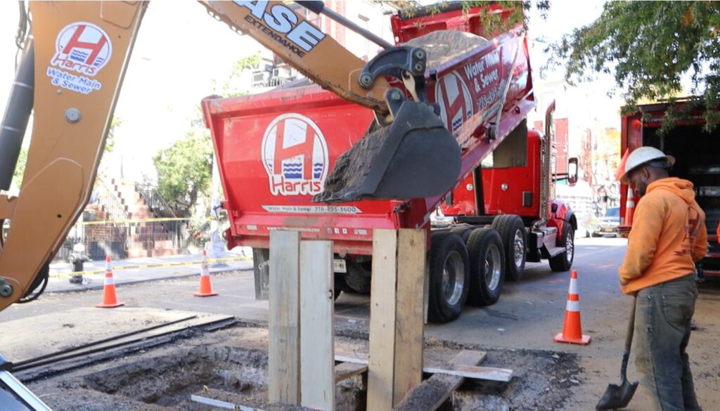Trenchless sewer line replacement equipment near Manhattan apartment building