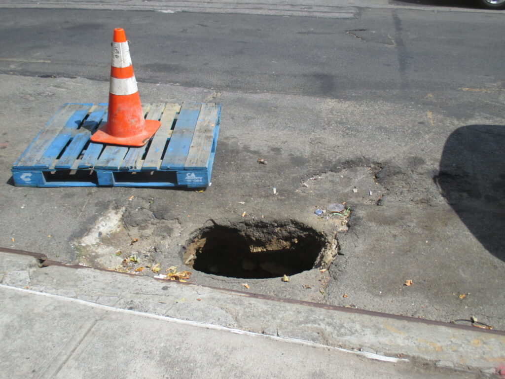 Broken sewer casues sink hole in roadway