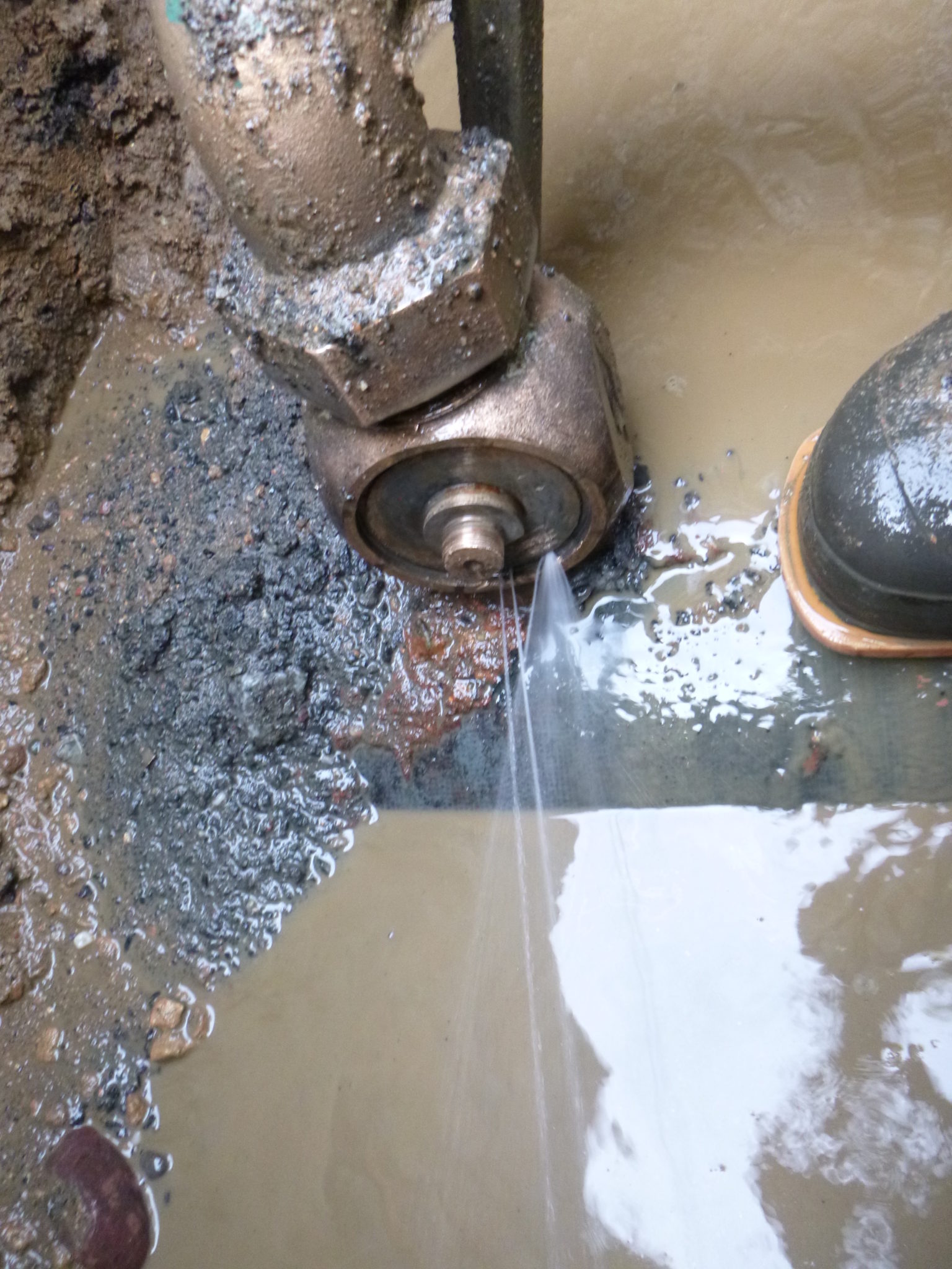 Water main tap leaking
