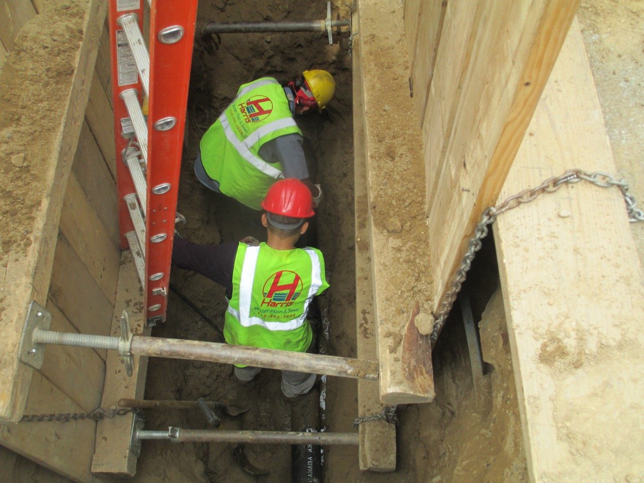 Installing new sewer line under street